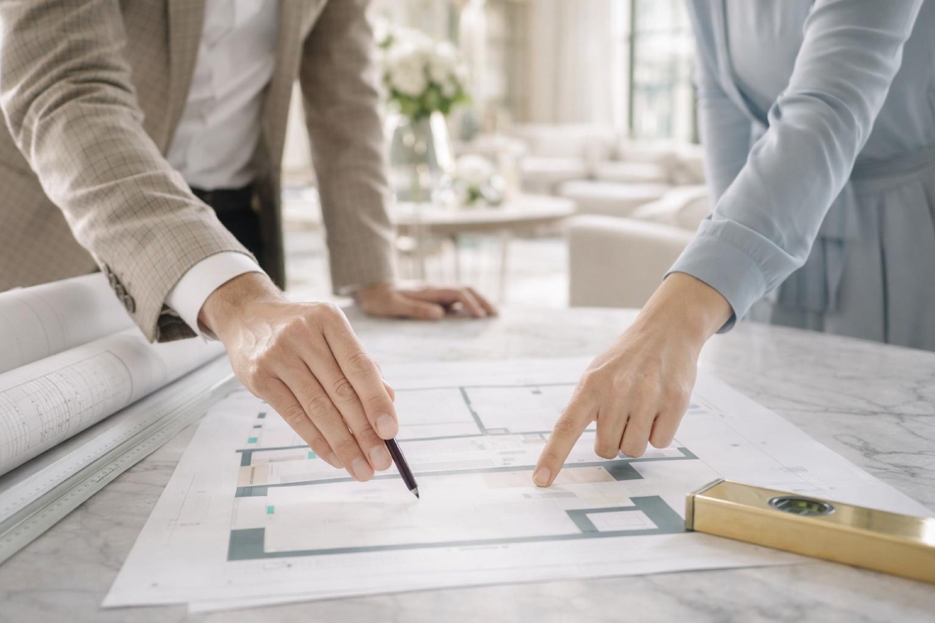 Property consultants reviewing blueprints