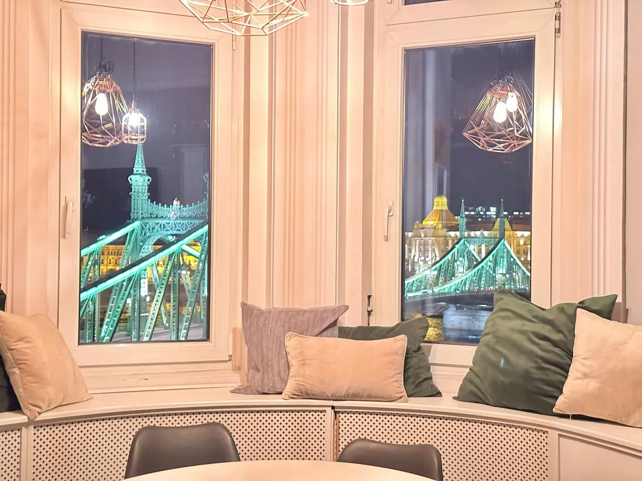 Window seat overlooking the illuminated Liberty Bridge in a professionally managed premium apartment in District V, Budapest