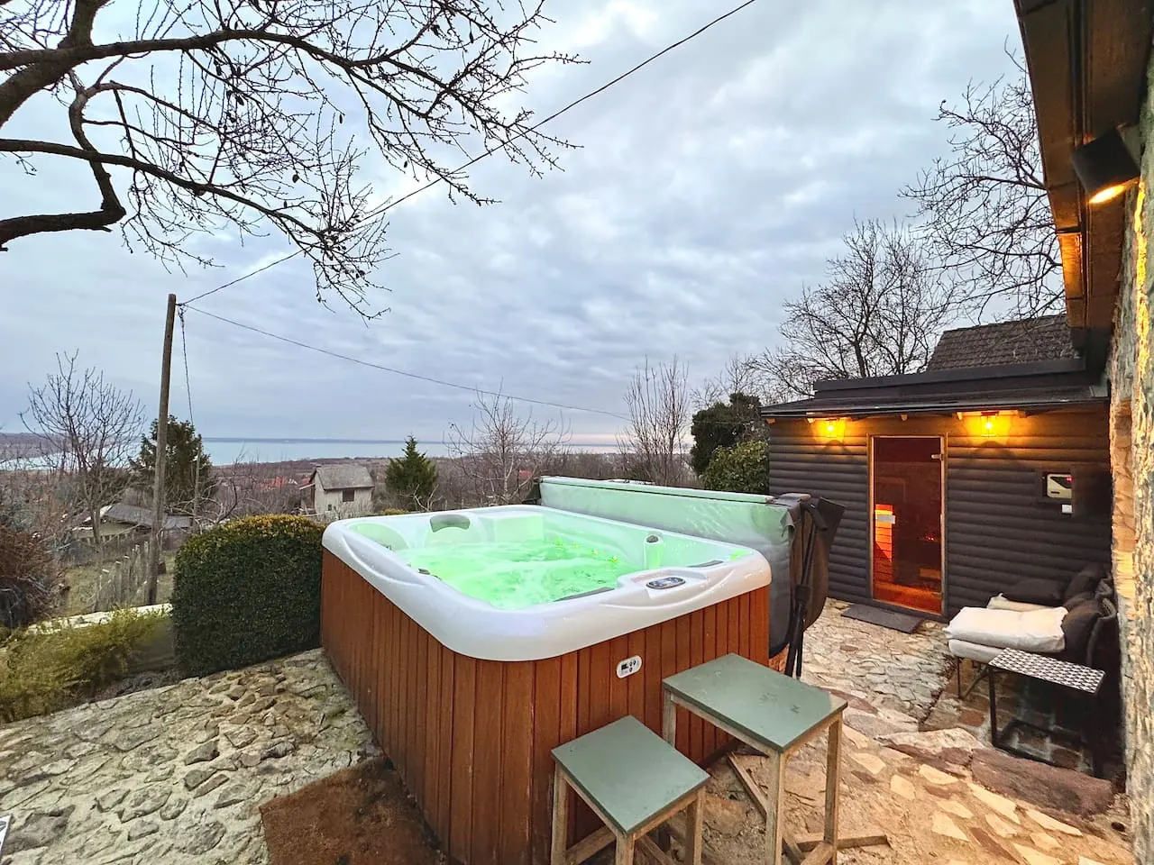 Outdoor hot tub and sauna at a professionally managed premium holiday house in Balatonalmádi, Hungary